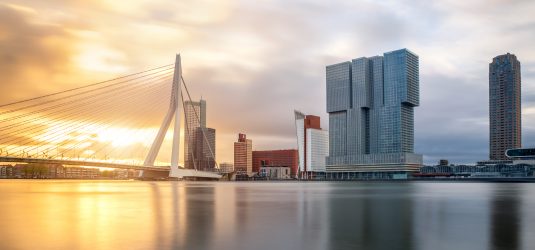 Rotterdam, Netherlands - April 27, 2016: Rotterdam Skyline with Erasmusbrug bridge in morning.